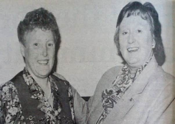 East Antrim Christian Endeavour immediate past president Ruth Hutchinson from Glengormley hands over the chain of office to June Ross of Carrickfergus. 1989.
