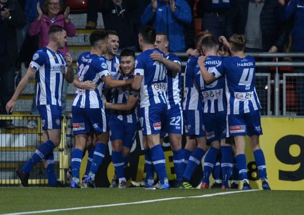 Coleraine's  Jamie McGonigle  celebrates with team mates after scoring one of his two goals in the 3-0 win over Crusaders