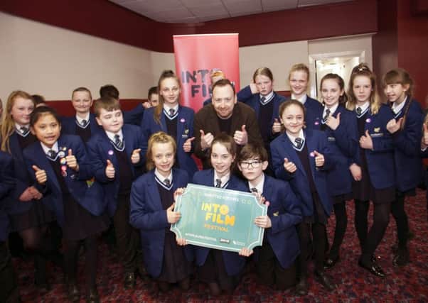 Pupils from Hazelwood Integrated College help launch the film festival which is coming to east Antrim venues in November.