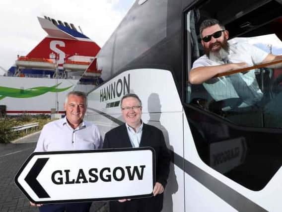 DRIVING GROWTH: Aodh Hannon (left) of Hannon Coach has revealed plans to expand the companys direct luxury coach service between Belfast and Glasgow to other towns across Northern Ireland. He is pictured with Stena Line's Ian Baillie (centre) and driver Jim McAlorum.