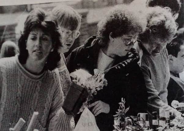 Hunting for bargains at the plant stand at the All Saints Church Summer Fete at Craigyhill. 1989. Click on the link below or image above to launch our gallery.
