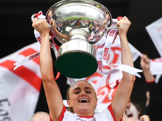 Tyrone captain Neamh Woods lifts the Mary Quinn Memorial cup following the TG4 All-Ireland Ladies Football Intermediate Championship Final match between Meath and Tyrone at Croke Park, Dublin