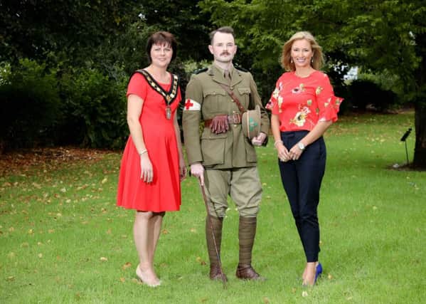 Lord Mayor of Armagh City, Banbridge and Craigavon, Councillor Julie Flaherty, joins broadcaster Claire McCollum and Ethan McNichol of NI Historical Airsoft Society ahead of a free commemorative event in Lurgan Park at 2pm this Saturday (22 September) Marking 100 Years since the end of the Great War.