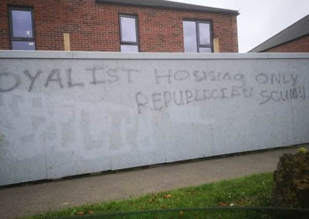The graffiti appeared at the site of a new shared housing development.