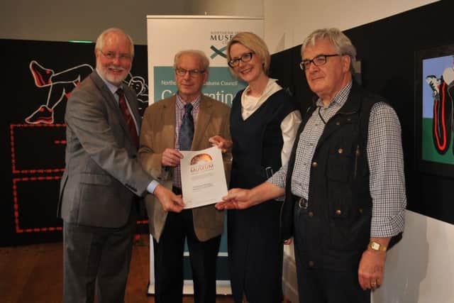 Allison Cosgrove, from the Department for Communities, presents (from left) John McKegney, Tony Ragg and Charles Friel of the RPSI with the accreditation certificate for Whitehead Railway Museum.