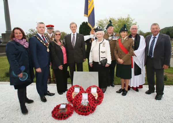 The Mayor, Cllr Paul Michael unveils the VC memorial stone with Her Majestys Lord Lieutenant for County Antrim Mrs Joan Christie CVO OBE, Yasmin Andrews (Lord Lieutenant Cadet), Graham and Nancy Clarke(Major Colvins Family), Sammy Wilson MP, Paula Bradley MLA, Joe Corr (Chairman of RBL Whiteabbey), Major George McFarland QVRM UD VR (Royal Irish), Major Stephen Montgomery VR (38 Irish Brigade) and Venerable Dr Stephen McBride (Mayors Chaplain).