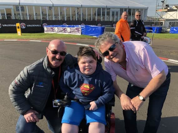 Josh poses with friends Adrian Logan and Liam Beckett.