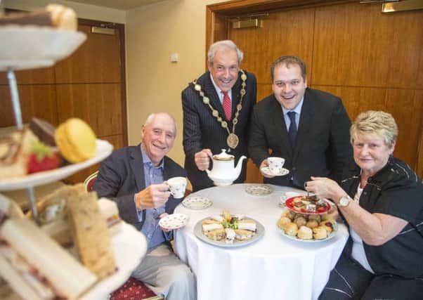 The Mayor, Councillor Uel Mackin is joined by Councillor Nathan Anderson, Chairman of the Council's Corporate Services Committee and Brian and Pauline Filcock to promote his upcoming Afternoon Tea events.