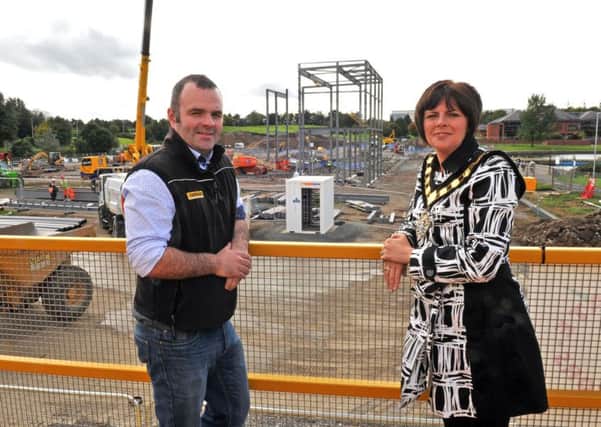 Lord Mayor of Armagh City, Banbridge and Craigavon, Councilor Julie Flaherty views the site of the New Leisure Centre with Project Manager Dwaine Rice.