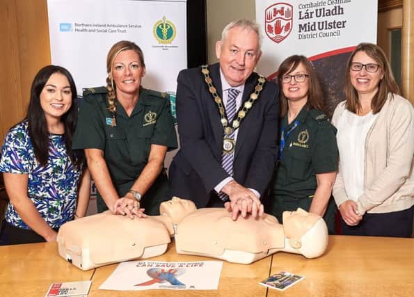Chair of Mid Ulster District Council, Councillor Sean McPeake is pictured learning some lifesaving CPR skills ahead of World Restart a Heart Day which takes place on Tuesday 16th October. Also pictured (l-r) are: Raisa Donnelly, Mid Ulster District Council; Stephanie Leckey and Mandy Hunt, Northern Ireland Ambulance Service; and Anne Caldwell, Mid Ulster District Council.