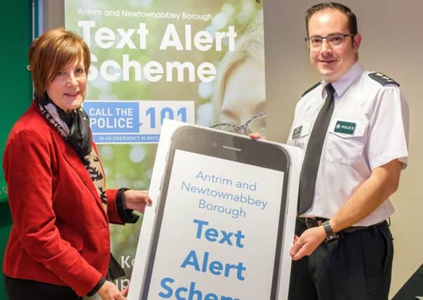 Antrim and Newtownabbey PCSP Chair, Cllr Noreen McClelland and PSNI Inspector Patrick Mullan launching the new Antrim and Newtownabbey Borough Text Alert Scheme.