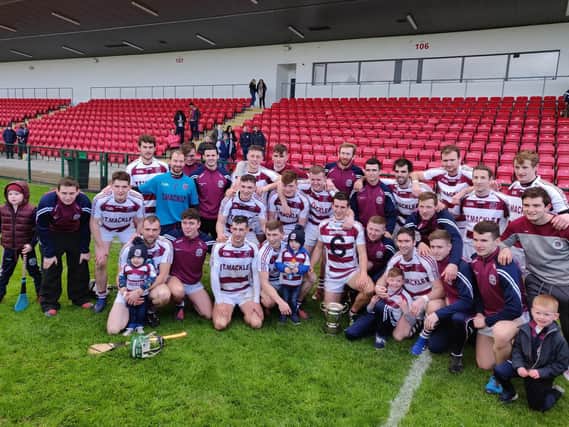 Slaughtneil players and supporters celebrate after defeating Banagher to retain their Derry senior hurling crown.