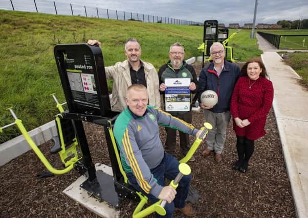 Pictured at St. Pauls GFC, who have received a Â£10k funding package from the Alpha Programme are Philip Mallon Jr, Club Chairman, Richard Rogers of Groundwork NI, Philip Mallon Snr, Trustee of St. Pauls GFC, Councillor Liam Mackle and Niamh-Anne McNally, Alpha Resource Management.