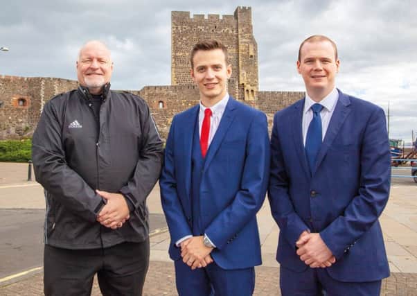 DUP Carrick Castle by-election candidate Peter Johnston (centre) alongside East Antrim DUP MLAs Gordon Lyons and David Hilditch.