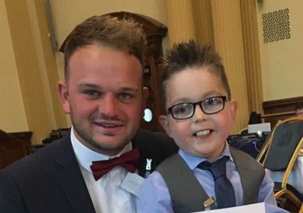 Ballymena boy Mark Lynn, aged 8, who lost his battle this week with congential heart disease. He is pictured with his brother Geoff at the British Heart Foundation's Heart Hero Awards in Belfast City Hall last year where he was named the Young Heart Hero.