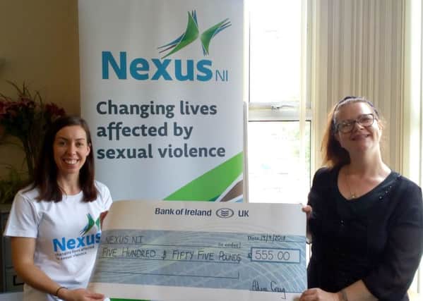 Aileen Craig presenting Nexus NI with a cheque for Â£555.