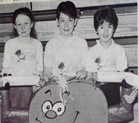 Roisin Scullion, Louise Agnew and Helen Etherson with Stubby Butts at the 'Smash the Ash' Sports event at the Seven Towers Leisure Centre. 1989.