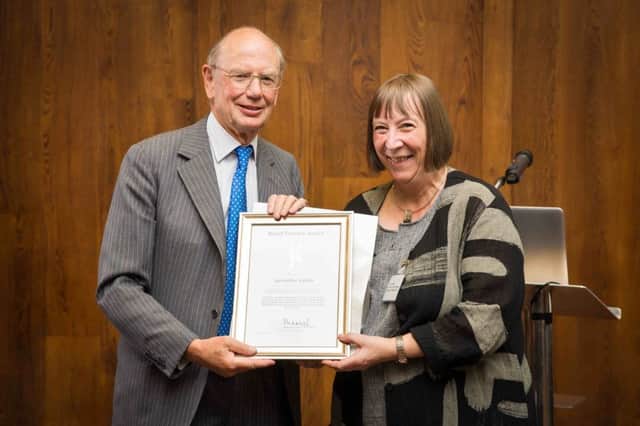 Geraldine Gilpin, chief executive of Abbeyfield & Wesley Housing Association, receiving her Royal Patron's Award 2018 from Ian Plaistowe, Abbeyfields chair.