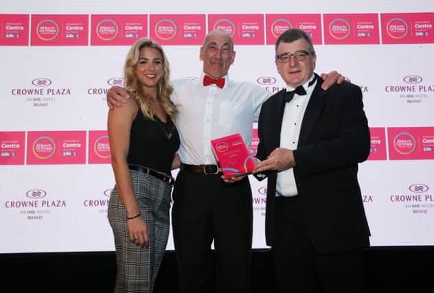 George Graham, General Manager of category sponsor Crowne Plaza Belfast and Strictly Come Dancing star and health and fitness advocate, Gemma Atkinson presents Gym Member of the Year Eddie Howarth with his trophy.