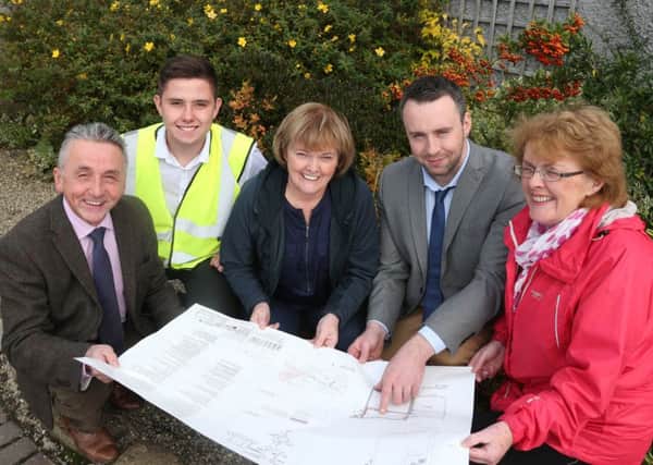 Pictured at Gortnaghey Community Centre, from left to right, Councillor William McCandless, Chair of the Peace IV Partnership Board; Kurt Wilson, AMS Ltd, Contractor; Eithne Burke, Centre coordinator and Carmel Hogan, Chair of the Community Centre Gortnaghey.