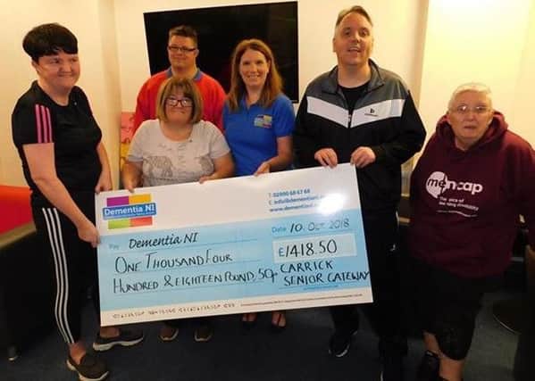 Carrickfergus Senior Gateway Club has been fundraising for Dementia NI. Pcitured from left:Tanya Rankin, Jeannette Craig, Stuart McQuistian, Fionnuala Savage, from Dementia NI, Gary McKee and Elizabeth Crozier.