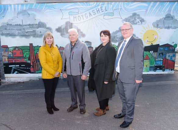 Fiona Stewart, artist; Victor McNickle, Moygashel Residents Group; Phyllis McWilliams, Principal, Howard Primary School and Michael Dallat, Mid Ulster Area Manager, NIHE.
