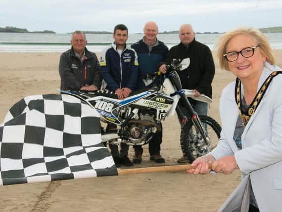 The Mayor of Causeway Coast and Glens Borough Council Councillor Brenda Chivers gets set for Portrush Beach Races which return on October 27th and 29th alongside Foyle District Motor Cycle Club representatives Eddie Johnston, Andrew Huston and Peter Bell with rider Michael McAlister.