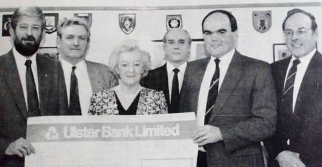 Trevor Taylor (second left) chair of the Police Federation Country Club presents a cheque for Â£1156 to Ian Hamill, chair of the Ballyclare and District Support Group to the Comber Romanian Orphan Appeal. Included are: the Mayor of Larne and the manager of the Club Neil Taylor. 1997