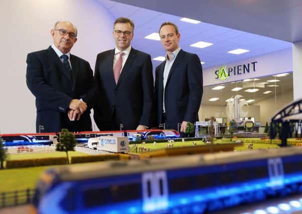 Pictured (L-R) are John Cunningham, CEO, Camlin, Alastair Hamilton, CEO, Invest NI and Peter Cunningham, Managing Director, Camlin. Photo by Kelvin Boyes  / Press Eye