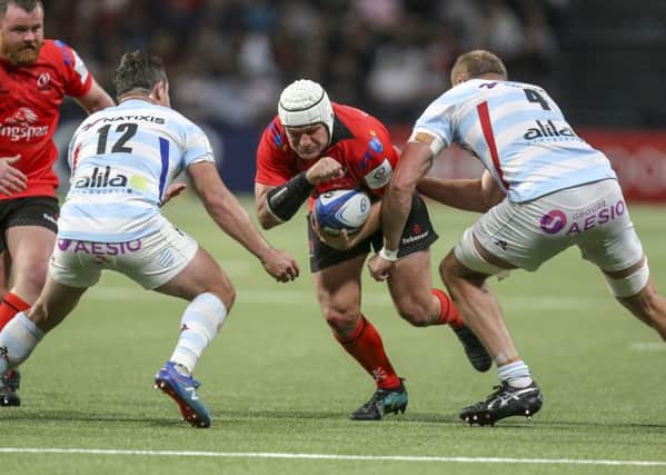 Rory Best is tackled by Racing's Henry Chavancy and Dominic Bird