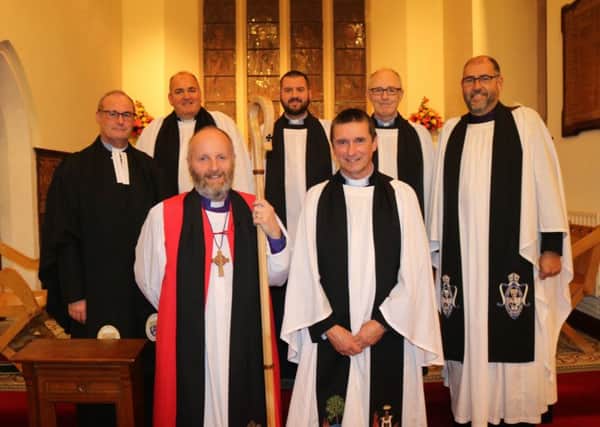 The new vicar of Carnmoney, the Rev Andy Heber, front right, with the Bishop of Connor, the Rt Rev Alan Abernethy, front left, at the Service of Institution in the Church of the Holy Evangelists on October 18. Back row, from left: The Rev Canon William Taggart, Registrar; the Rev John McClure, Bishops Chaplain; the Rev Brian Lacey, North Belfast Rural Dean; the Rev Alan Barr, preacher; and the Ven George Davison, Archdeacon of Belfast.