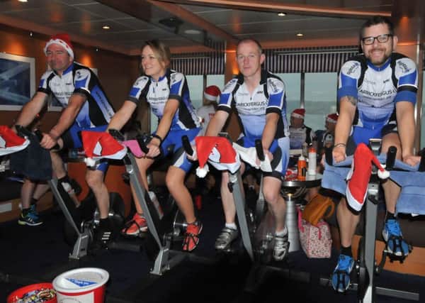 Members of Carrickfergus Cycling Club in action during la previous "Walk to Scotland" fundraiser.