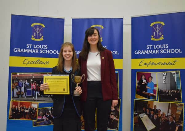 Top Performing Pupil in Year 10 Lucy Donaldson proudly displays her cup and certificate.