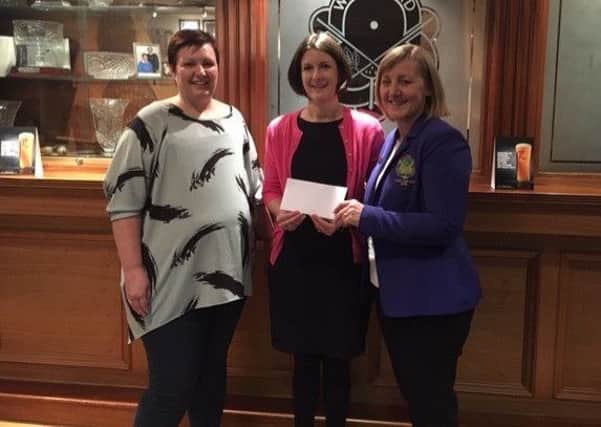 Elaine Arthurs raised Â£2711 for Breast and Ovarian Cancer Research at Queen's University Belfast at her Lady Captain's Day, at Whitehead Golf Club, in July. She is pictured presenting a cheque to Rachel Ketola (centre)  from Queen's and Lynette McHendry (left).