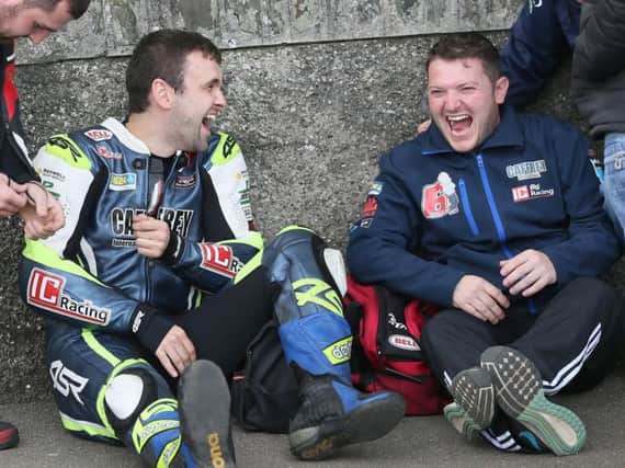 Cousins William and Gary Dunlop share a joke at the Classic TT Races in 2017.