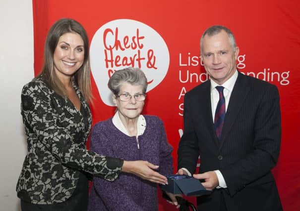 Northern Ireland Chest Heart and Stroke volunteer Margaret McCrory receives an award for 29 years service from  Declan Cunnane, Chief Executive, and Sarah Travers at the charitys annual conference on 18th October. Margaret has been volunteering for Northern Ireland Chest Heart and Stroke for 29 years as an active fundraiser in the Ballymena area and Ballymena Fundraising support group. The streets in Ballymena have been pounded many a time by Margaret out raising awareness about the work of Northern Ireland Chest Heart and Stroke.