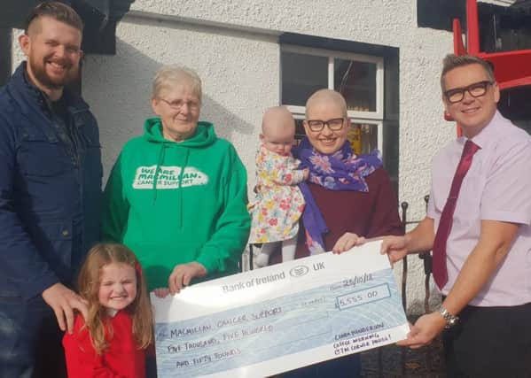 Ciara Henderson from Lurgan hands over a cheque for Â£5,555.00 to MacMillan Cancer Relief. Ciara is pictured with her husband Bradley and their two children Olive aged four and Edith aged seven months as well as Trevor McCann, owner of the Corner House in Derrymacash. Ciara raised the money by holding a Coffee Morning at the Corner House. Ciara had been diagnosed with Hodgkin's lymphoma earlier this year. She wanted to raise money for MacMillan as they had been very helpful during her treatment.
