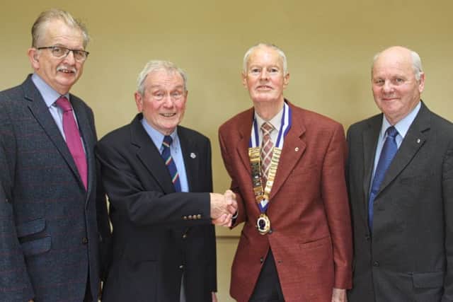 Coleraine Probus Club President Des Moore greets Eric Lake, with two of the newest club members John Christy (L) and Maurice Platt (R).