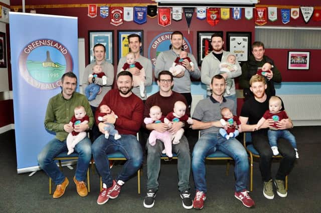 Greenisland Football Club players and their babies.