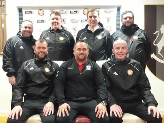 Martin Carter (front row, centre) with Portadown FC Youth officials. Back row, from left, Simon Eakin, Jeff Kerr, Alan Curran, Jason Hall. Front row, from left, Gary Magee and Noel Cowan.