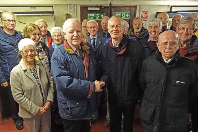 President Des Moore is greeted by Wilbert Patterson when members of the club visited the Garvagh Museum recently.