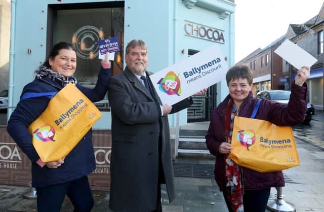 The Ballymena Means Discount Day social media competition, for two vouchers worth Â£100 are Linda Lowry (left) and Catherine Moore (right), pictured with BID Chairman, Clive Kyle.