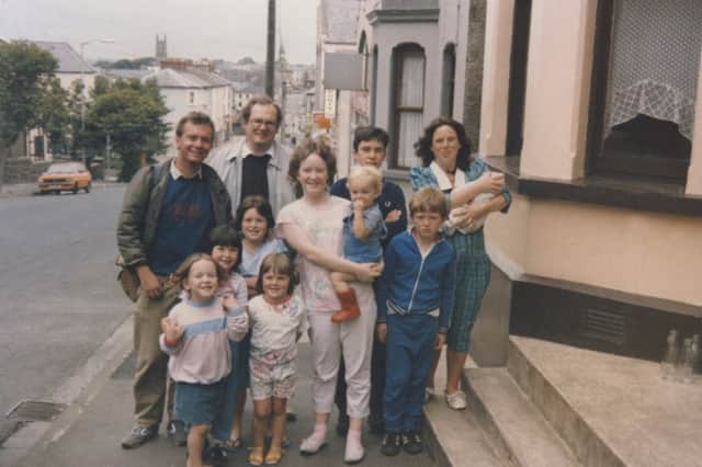 The McCauley family with two German visitors. From left to right, Hannah, Mary, Nora, Ruth, Shann holding John, Brendan, Aaron and Mum Angela holding Patrick.