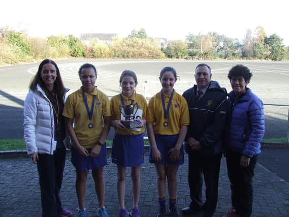The top three finishers in the Loreto College Year 8 Girls Cross Country Race, pictured with Mrs McBroom, Mr James and Mrs McCullough.