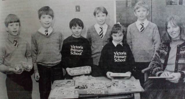 Teacher Alison McNeilly, pictured with Victoria Primary School pupils who organised a variety sale which raised Â£338.50 for Children In Need. 1991.