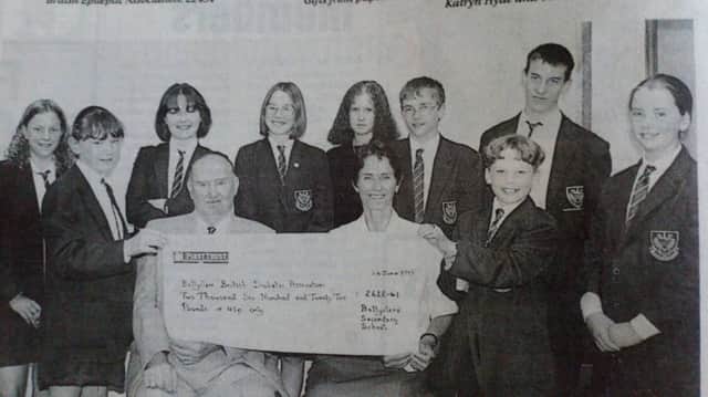 Ballyclare Secondary School pupils present a cheque for Â£2,622 to Alec Scott of the Ballyclare branch of the British Diabetic Association and Hilary Tennent of the Royal Victoria Hospital. Pictures from the Newtownabbey Times archives, 1997.