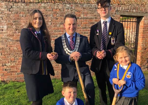 Pictured are (l-r back) Kathryn Murphy, Wallace High School's Interact Club, Jonathon Simpson, President of the Lisburn Rotary Club, Chris Dumigan, Wallace High School's Interact CLub along with (front row) Ryan Hewitt, Secretary and Carla Greer President of Knockmore Primary School's Rotakids Club.