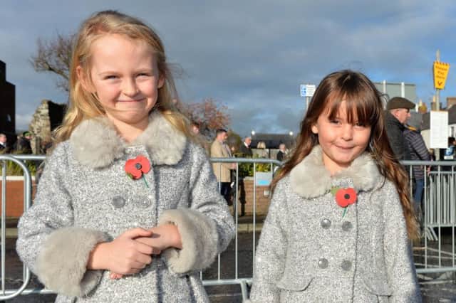 Sisters Amelia and Charlotte Everitt at the Service of Remembrance in Carrickfergus. INCT 46-015-PSB