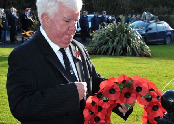 Liam Kelly, JP, Deputy Lord Lieutenant for Co. Antrim places his wreath. INLT 46-202-AM