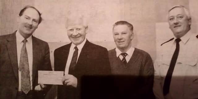 The Carrickfergus RUC annual charity indoor bowling tournament raised Â£1500 for the Philip Hunter Appeal Fund. Supt. Rodney Lurring (left) presented the cheque to Robert Hunter. Included are station sergeant Mark Caruth and tournament organiser Eddie Wilkie, 1991.